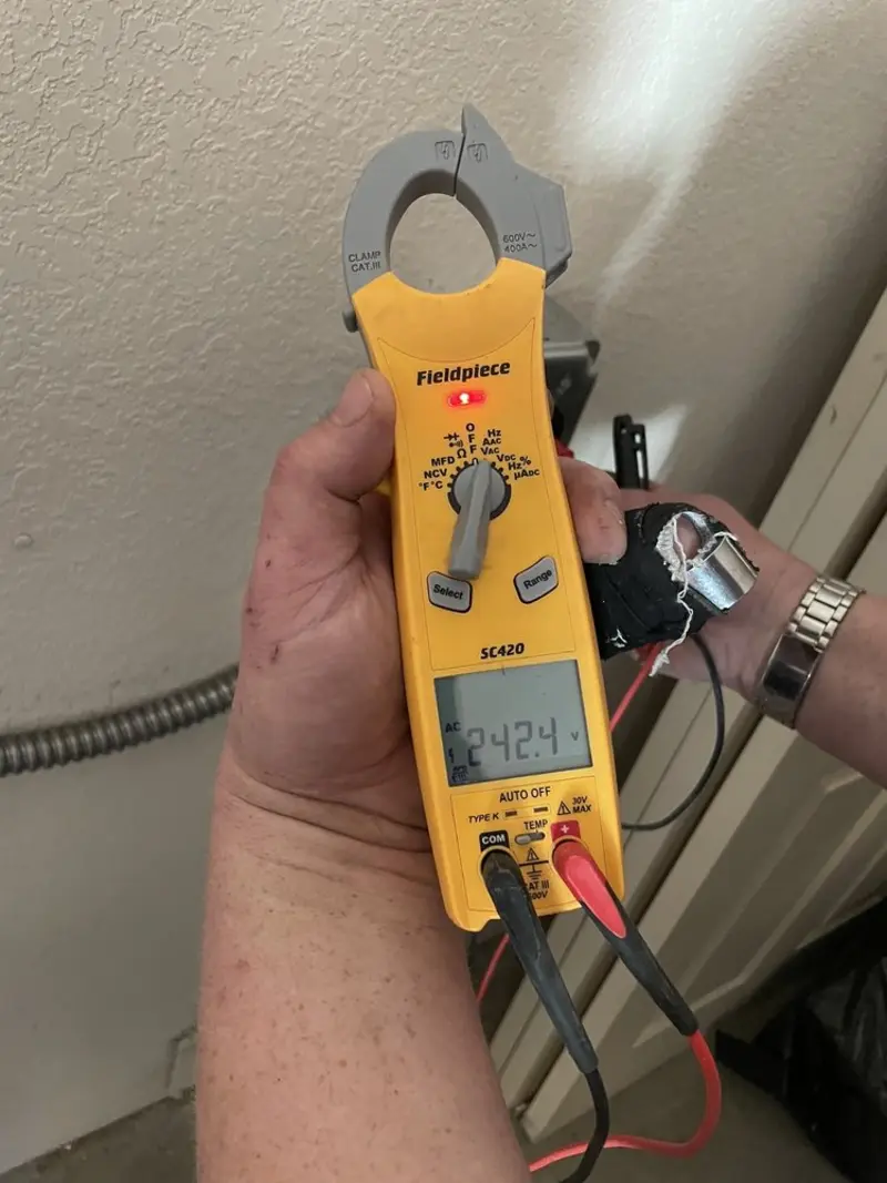 Voltage testing with clamp meter during Ceiling Fan Installation in McHenry